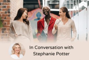 Three professional women talk in a modern office hallway, reflecting collaboration and workplace connection. Text reads "In Conversation with Stephanie Potter," featuring her headshot—smiling warmly, wearing a white shirt, with blonde shoulder-length hair—highlighting her role as an ADHD coach discussing career success.