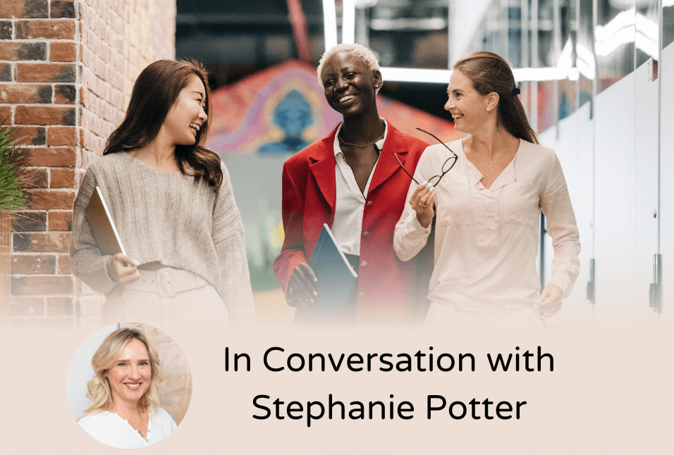 Three professional women talk in a modern office hallway, reflecting collaboration and workplace connection. Text reads "In Conversation with Stephanie Potter," featuring her headshot—smiling warmly, wearing a white shirt, with blonde shoulder-length hair—highlighting her role as an ADHD coach discussing career success.